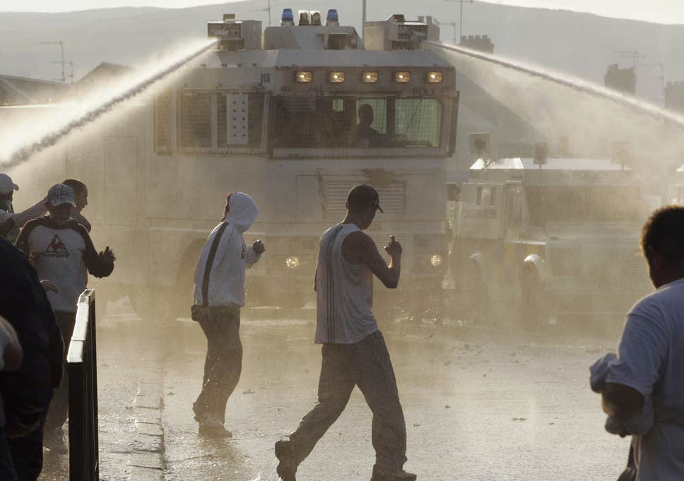 PSNI (Police Service of Northern Ireland) use a water cannon during riots on the Crumlin Road in 2005 in north Belfast PSNI (Police Service of Northern Ireland) use a water cannon during riots on the Crumlin Road in 2005 in north Belfast